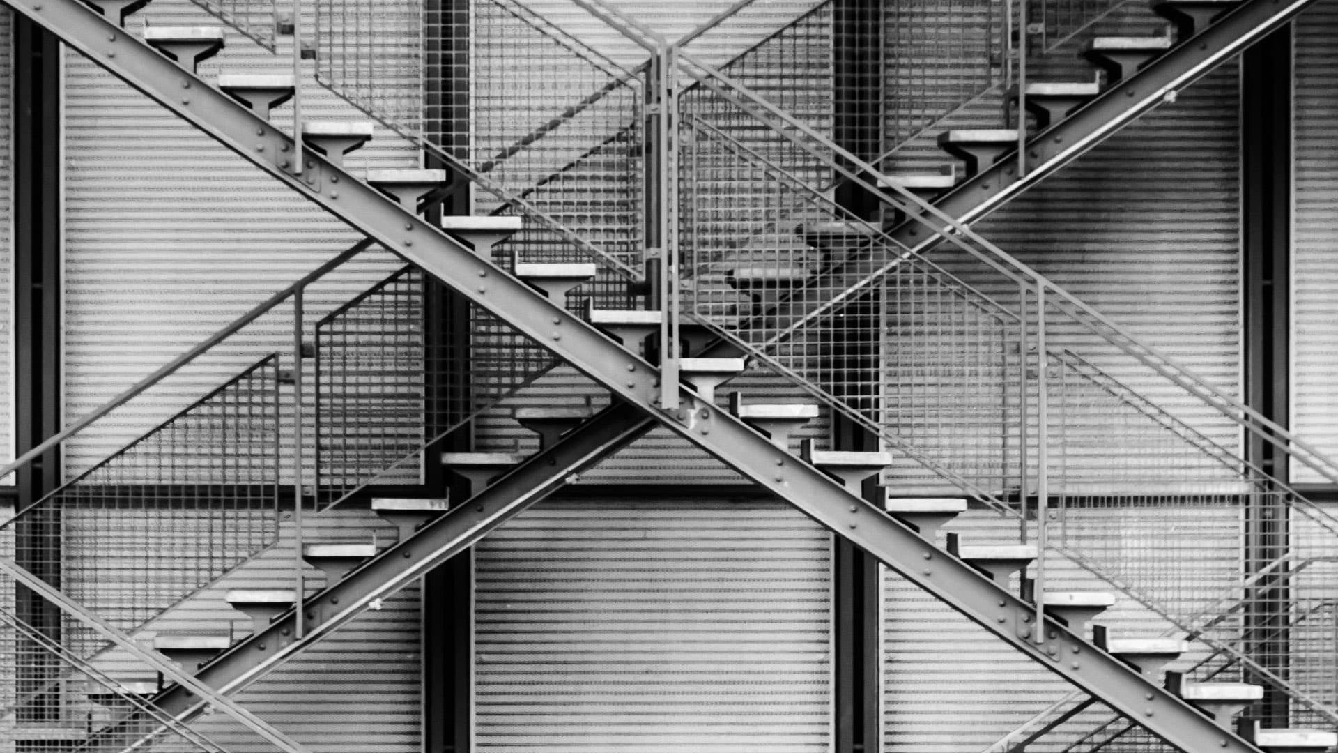 Sunlit arches forming the vaulted ceiling of a grand hall